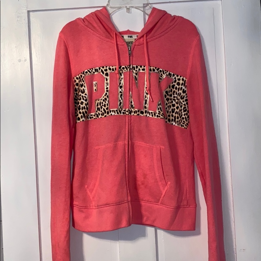 A zip up sweater from pink